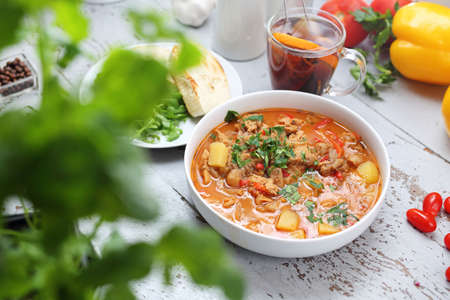 Tasty dish, dinner dish on a white wooden tableの写真素材