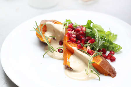 Tasty dish, dinner dish on a white wooden tableの写真素材