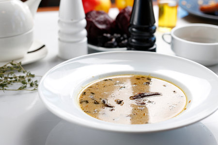 Mushroom soup, a traditional Christmas dish in Polish cuisine. Appetizing dish served on a plate. culinary photography, food styling.の写真素材