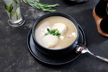 Cream soup. Creamy white vegetable soup. Food served on a plate, food styling, serving suggestions, culinary photography.の写真素材