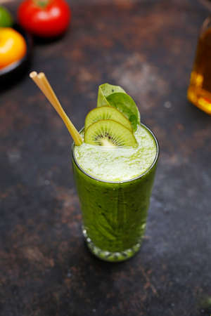 Green smoothie of kiwi, spinach and celery. A refreshing healthy green fruit and vegetable smoothie.の写真素材