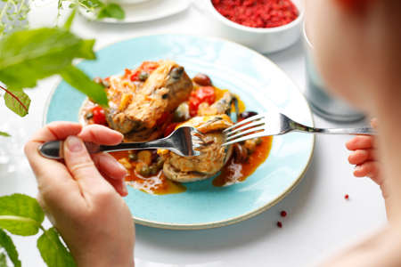 Stewed mackerel in tomato sauce with capers served on toast. Mackerel baked in tomato sauce with capers. Suggestion of serving a dish on a plate. food backgroundの写真素材