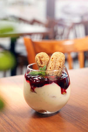 Panna cotta in a cup. Sweet fruit dessert. A light yoghurt dessert with fruit mousse and sponge...
