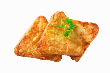 3 Potato Rosti isolated on white with parsley