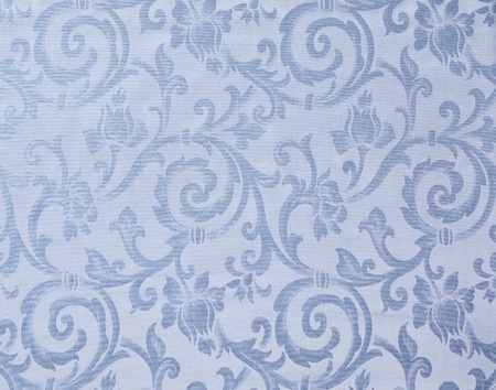 Abstract background of a heavy light blue brocade fabric with interwoven repeat design.の写真素材