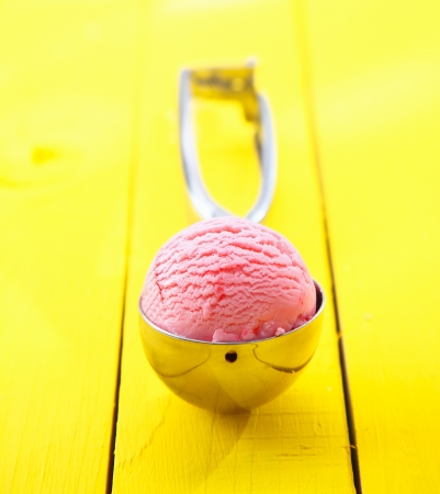 Close up shot of ice cream scoop with ice cream in it - shallow DOFの写真素材