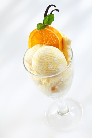 Delicious ice cream with fresh oranges and mint leavesの写真素材