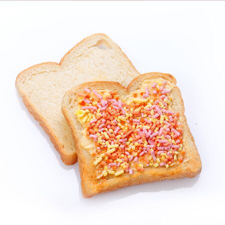 Elegant dessert made of two slices of bread with candiesの写真素材