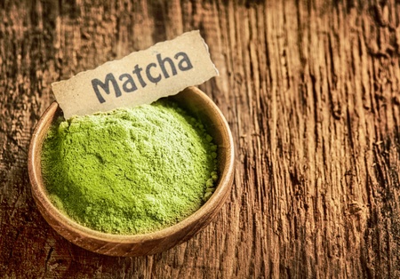 Matcha powder masde from ground green tea used as a traditional Japanese beverage and as a...