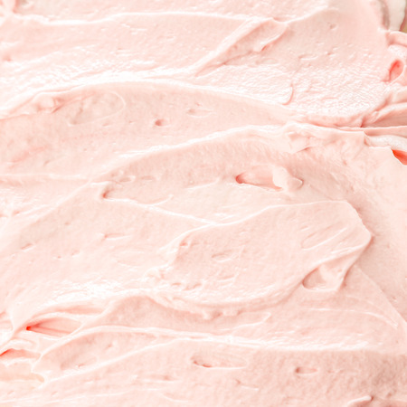 Creamy pink berry ice cream or frozen yoghurt background for a delicious cold summer treat, texture detailの写真素材