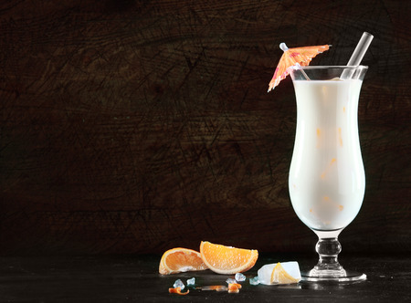 Delicious pina colada cocktail with rum, cream of coconut and pineapple for an exotic beverage to...