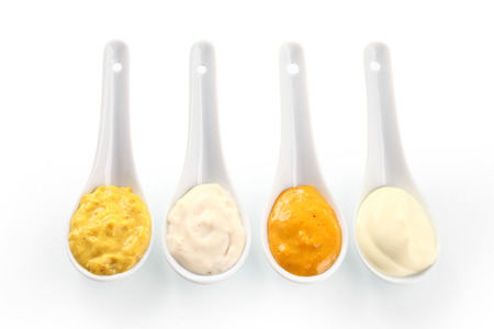 Close up Spicy Rub and Marinade Pastes on Serving Spoons on White Background.の写真素材