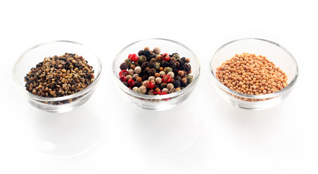 Close up Hot Seed Type Spices on Transparent Glass Bowls, Isolated on White Background.