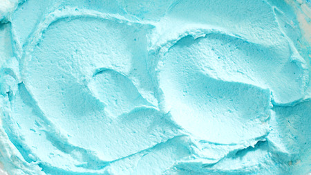 Close Up of Creamy Blue Swirled Ice Cream in Vat, Full Frame Backgroundの写真素材