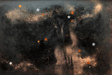 Little Stars and Snow Flakes on a Glittery Black Background with Gold Dust and Copy Space.の写真素材