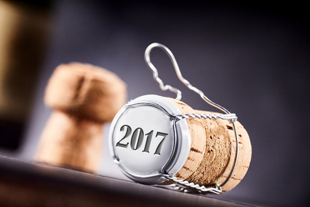 Cork and metal bottle cap close up from slanted angle. The year 2017 in focus on top section.