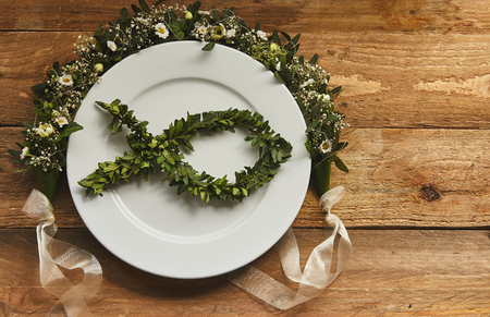 Place setting of Ichthys symbol on wooden backgroundの写真素材