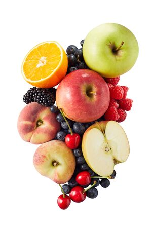 Several different halved and whole fruits including apples blueberries and oranges in pile on bright white backdropの写真素材