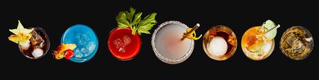 Top down panorama banner or header of a variety of different colorful exotic alcoholic cocktails...
