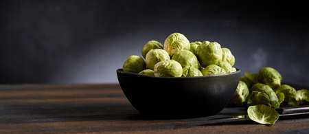 From above tasty noodles with mushrooms and broccoli served on tray near sauerkraut and chopsticks with saucesの写真素材