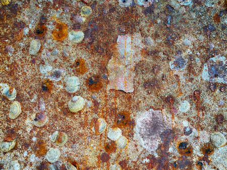Textured background of aged shabby metal wall with corrosion and dirty uneven surface