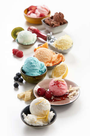 Individual servings of assorted flavors of artisanal or craft ice-cream with a variety of tropical...