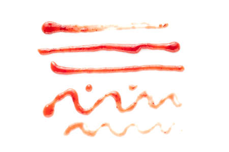 Selection of lines and squiggles drawn in red berry jam on white for use as design elementsの写真素材