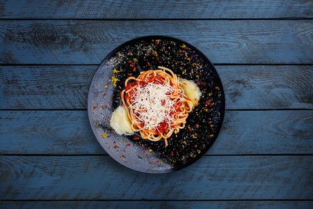 Pasta Arabyata with tomatoes and cheese.の写真素材