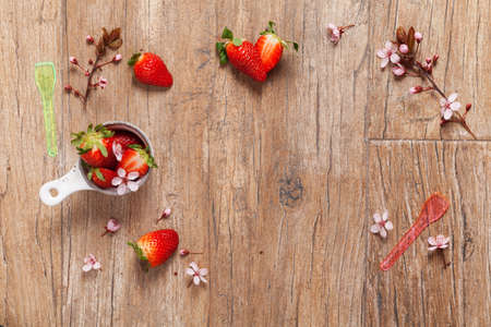 Composition of strawberries on wooden backgroundの写真素材