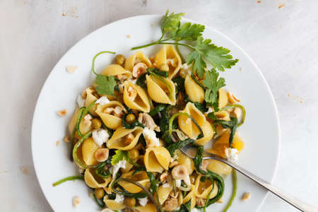 Plate of typical food Italian, shells of pasta with tops of turnipの写真素材