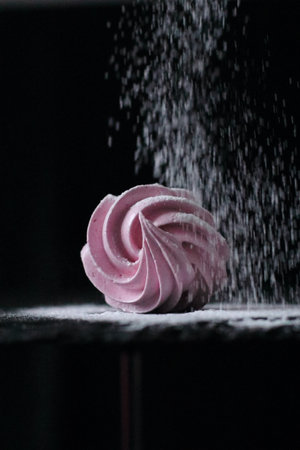 Pink raspberry marshmallow Zephyr sprinkled with sugar powder. Sweet dessertの写真素材