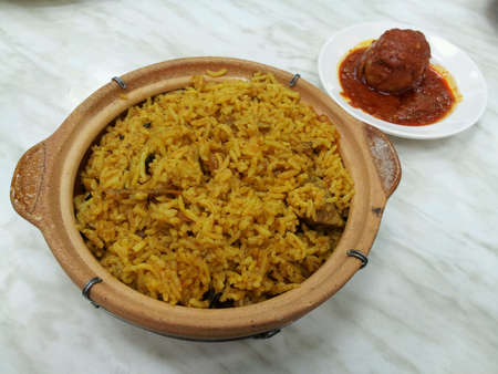 Claypot mutton briyani rice served with egg sambalの素材
