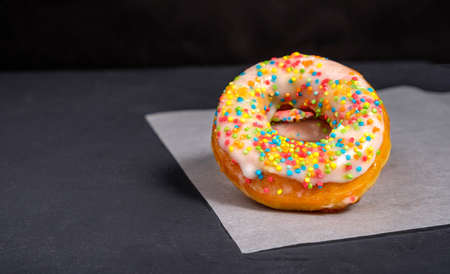 Donuts with sprinkles in the foreground
