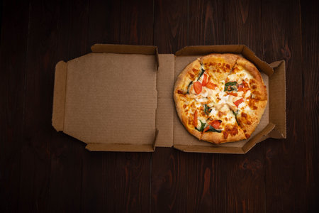 Pizza with cheese, herbs and hamの写真素材
