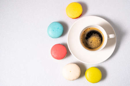 Coffee and macaroons on a white background. View from above.の写真素材