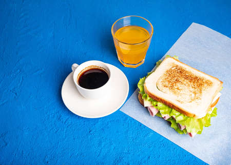 Sandwich with bacon, tomatoes and herbs.の写真素材