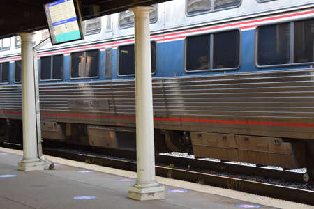 Alexandria, VA, USA - June 30, 2021: Amtrak Train Arrives at the Station on King Street in...