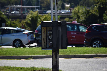 Open Public Pay Telephone Next to a Parking Lotの写真素材
