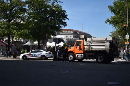 Washington, DC, USA - October 2, 2021: Police Cars and Municipal Trucks Act as a Barrier and  Provide Security at the Womenâs March at Freedom Plazaのeditorial素材