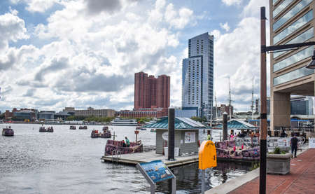 Baltimore, Maryland, USA - October 9, 2021: Looking Out Over the Baltimore Inner Harbor Where Tourists Ride in Pirate Themed Paddle Boatsのeditorial素材