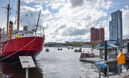 Baltimore, Maryland, USA - October 9, 2021: Looking Out Over the Baltimore Inner Harbor Where Tourists Ride in Pirate Themed Paddle Boatsのeditorial素材