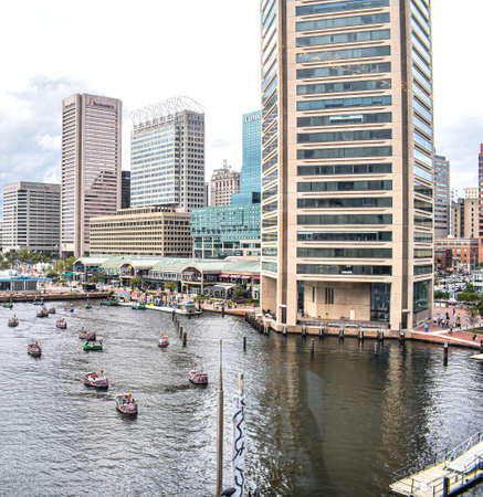 Baltimore, Maryland, USA - October 9, 2021: Looking Out Over the Baltimore Inner Harbor Where Tourists Ride in Pirate Themed Paddle Boatsのeditorial素材