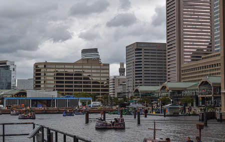 Baltimore, Maryland, USA - October 9, 2021: Looking Out Over the Baltimore Inner Harbor Where Tourists Ride in Pirate Themed Paddle Boatsのeditorial素材