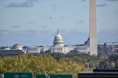 Washington, DC, USA - October 27, 2021: U.S. Capitol Building, Framed by Trees in the Foreground, as Seen from a Hill in Arlington Ridge Park on a Clear Fall Afternoonのeditorial素材