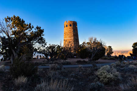 Grand Canyon National Park, Arizona, USA - November 22, 2021: Mary Colterâs Desert View Watchtower at Sunset as Seen from the South Rim of the Grand Canyon on a Late Fall Dayのeditorial素材
