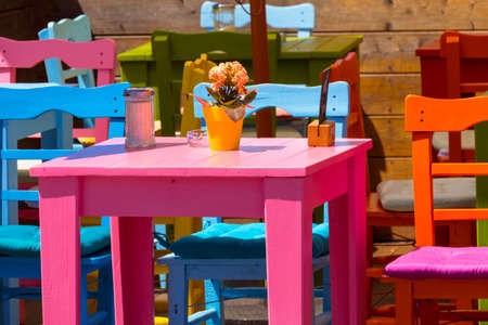 Colourful tables and chairs in a cafe on the harbor, Lindau, Bavaria, Germany, Europe