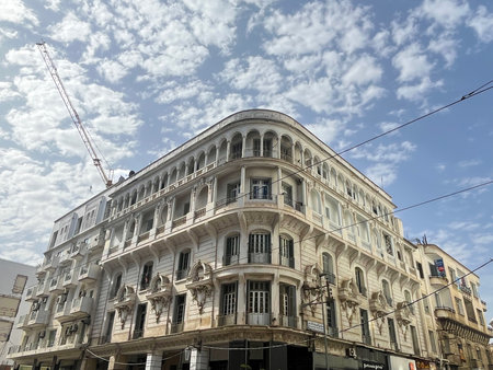 Ornate white building with balconies and arches located in the Old Medina of Casablanca, Morocco, reflecting the city's rich history and unique architectural charm.の写真素材