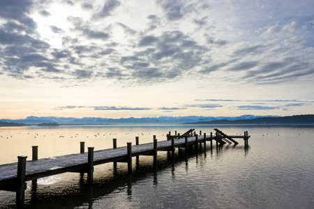 old wooden jetty at a lakeの写真素材