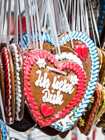 typical souvenir at the oktoberfest in munich - a gingerbread heartの写真素材