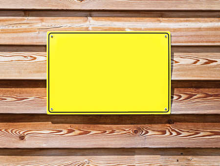 blank sign at a wall - nice background with space for textの写真素材